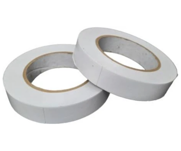 Two rolls of white tape on a gray background