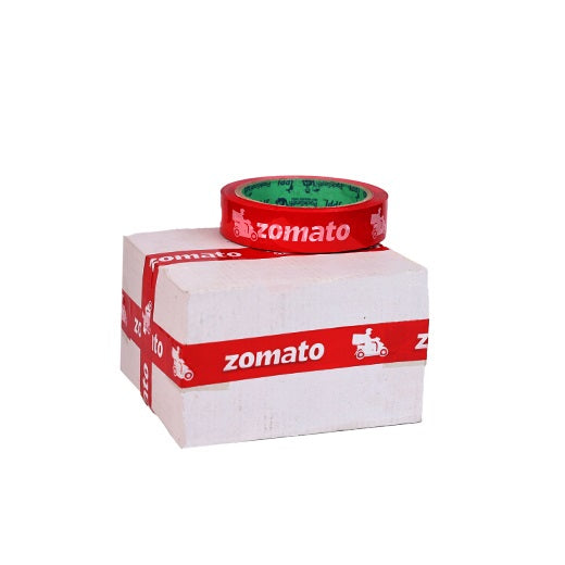 Food delivery tape for Zomato partners, red 1 inch roll on a white box sealed with the same tape